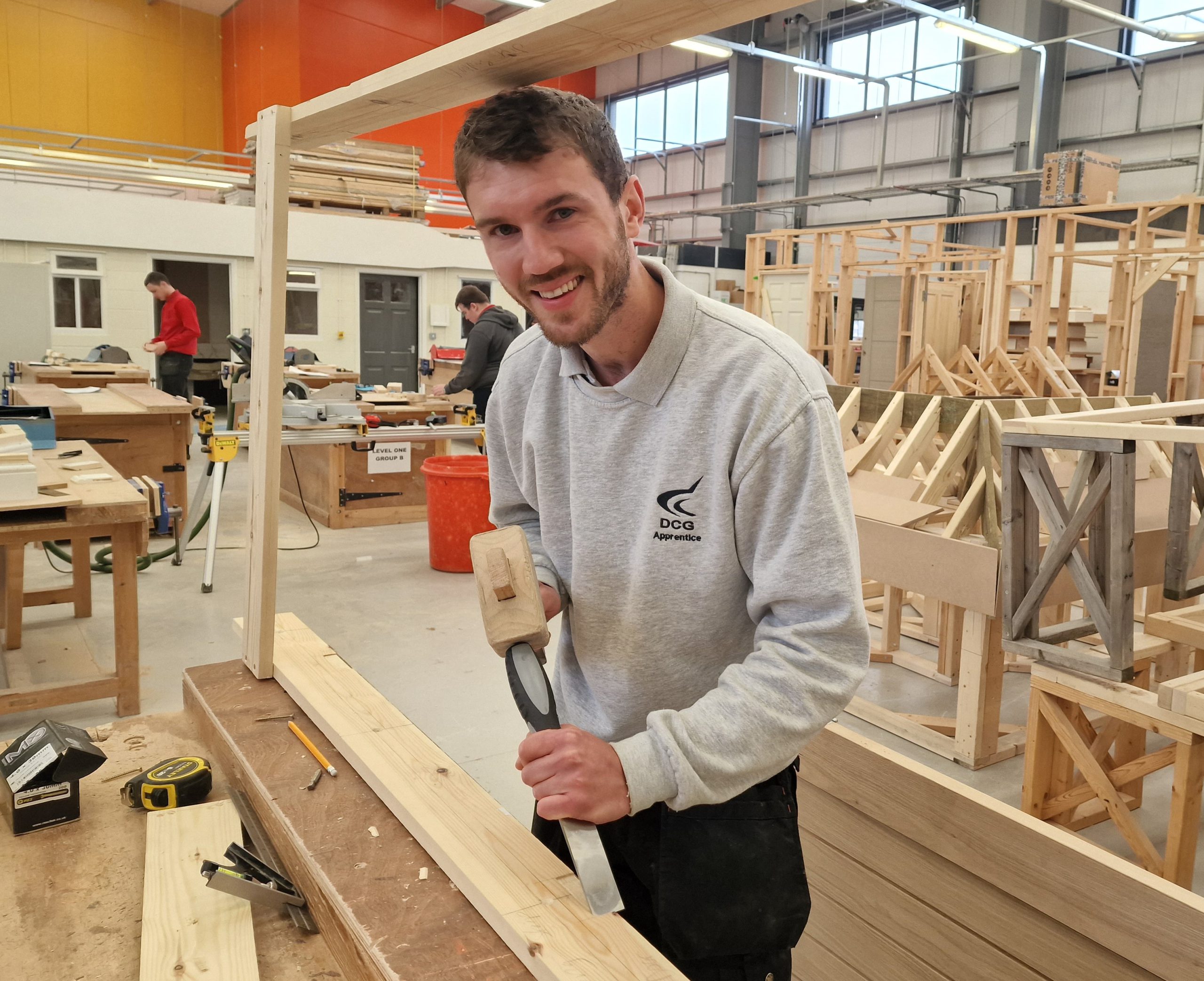 DCG Carpentry apprentice Alex Avis plaining wood at Screwfix