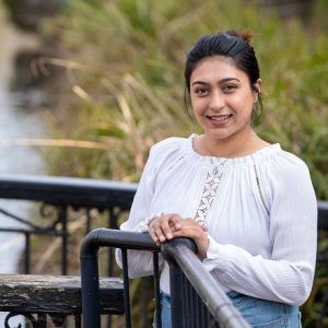 Halima Khanom stood by a body of water.