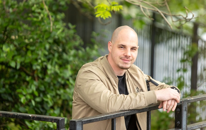 Seb Kowarski leaning up against a rail at Broomfield Hall.