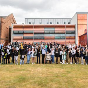 Business students jumping in the air at the Roundhouse College