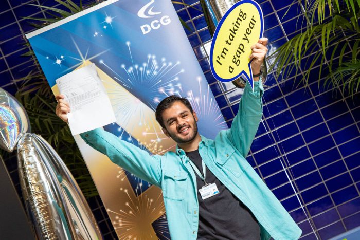 Hamza holding his results.
