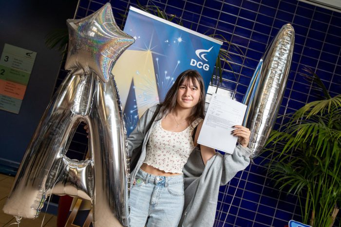 Emma holding her results.