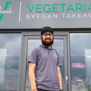 Charanjot Singh stood outside of his takeaway restaurant V Shack.