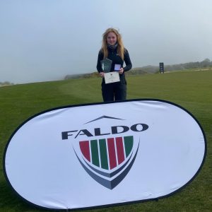 Derby College Sport student Ella Whaley holding an award and certificate.