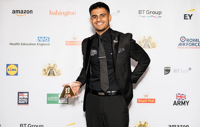 Former Derby College apprentice Ali Amin holding his award.