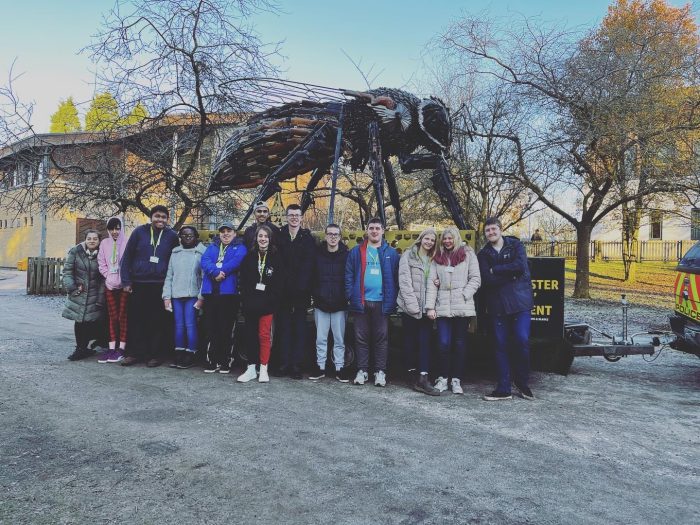 Students at Broomfield Hall stood by the bee.