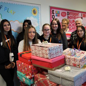 Childcare students stood by their gift boxes.