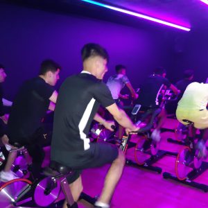 Students using cycling machines