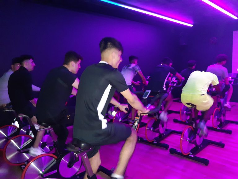 Students using cycling machines