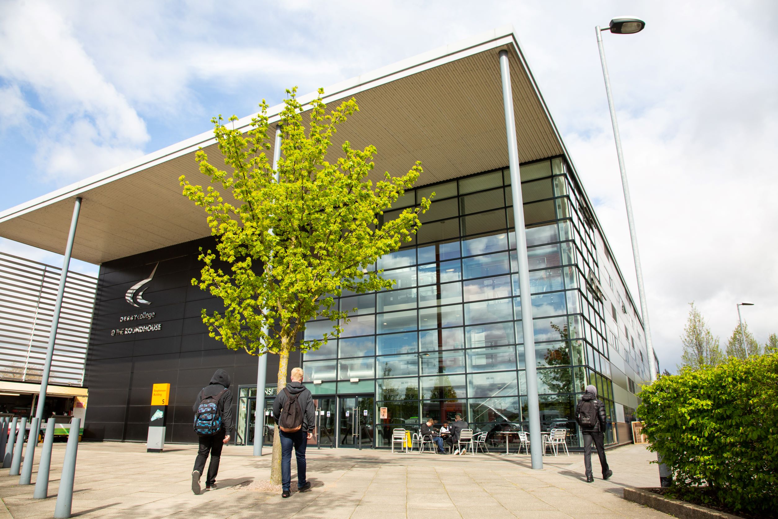 Students walking outside of the Roundhouse where exams will take place