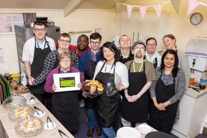 Members of the Inclusion team with students at the cafe