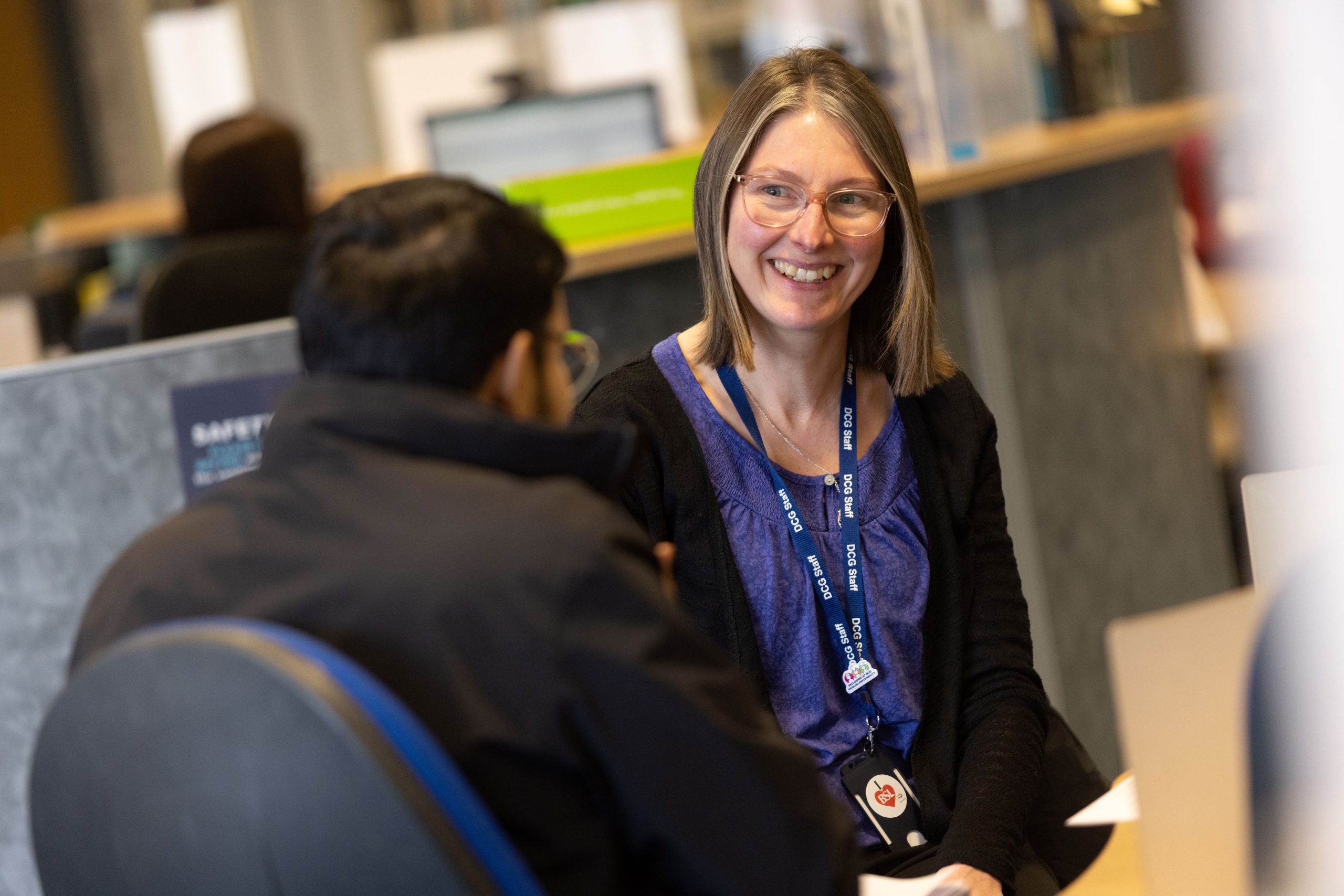 Member of student services advising a student.