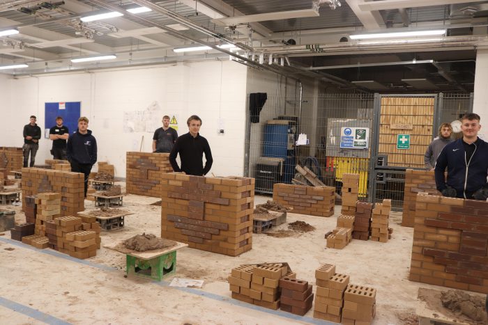 Students stood by their brickwork.