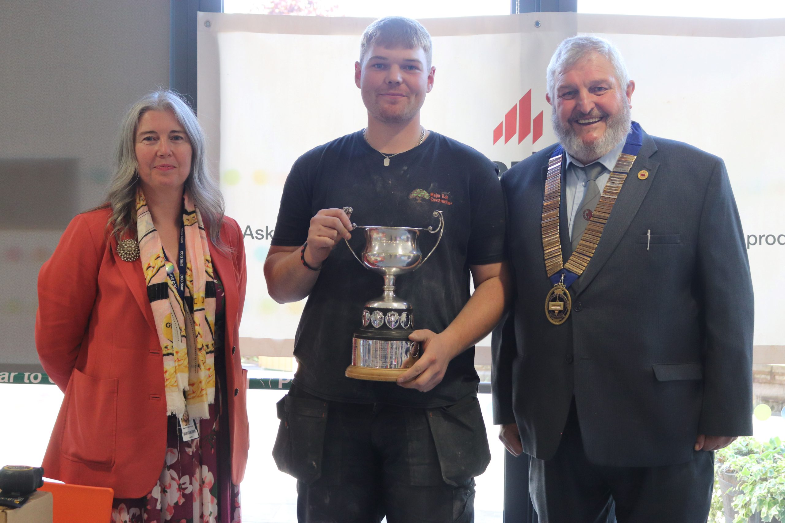 Senior Competition winner and DCG student, Matthew Wooley with DCG CEO Mandie Stravino OBE MBA and The Guild of Bricklayers President Mr Bill Bowmen