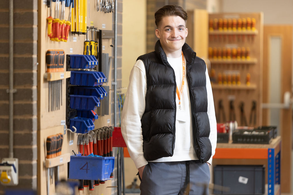 Former Derby College Electrical Installation student Adam Luckett stood by some tools.