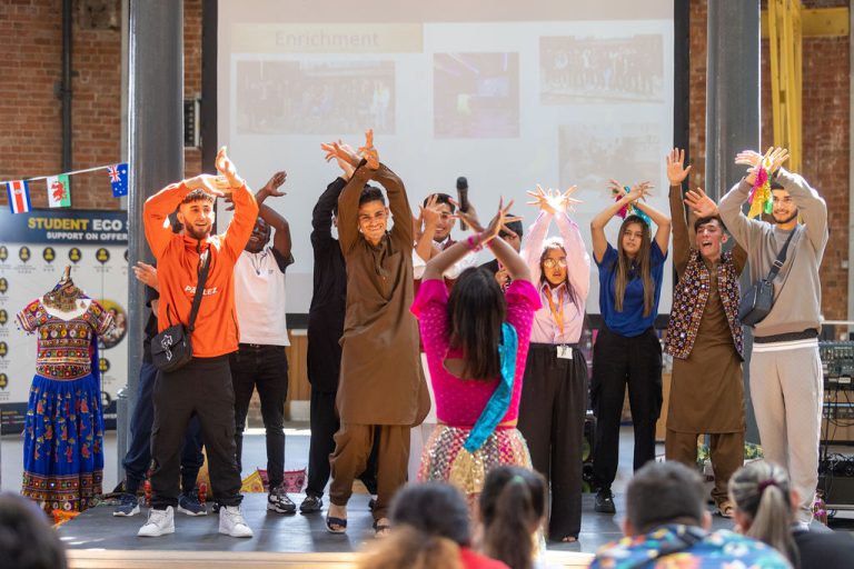 Lexis students being taught how to dance.