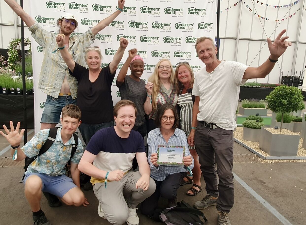 Horticulture students holding their certificate.