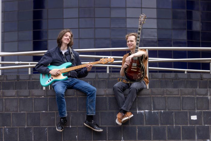 Declan and Owen sat outside of The Joseph Wright Centre. 