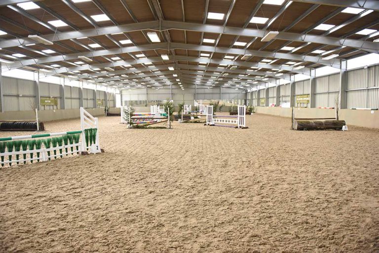Equine centre with hurdles and other obstacles.