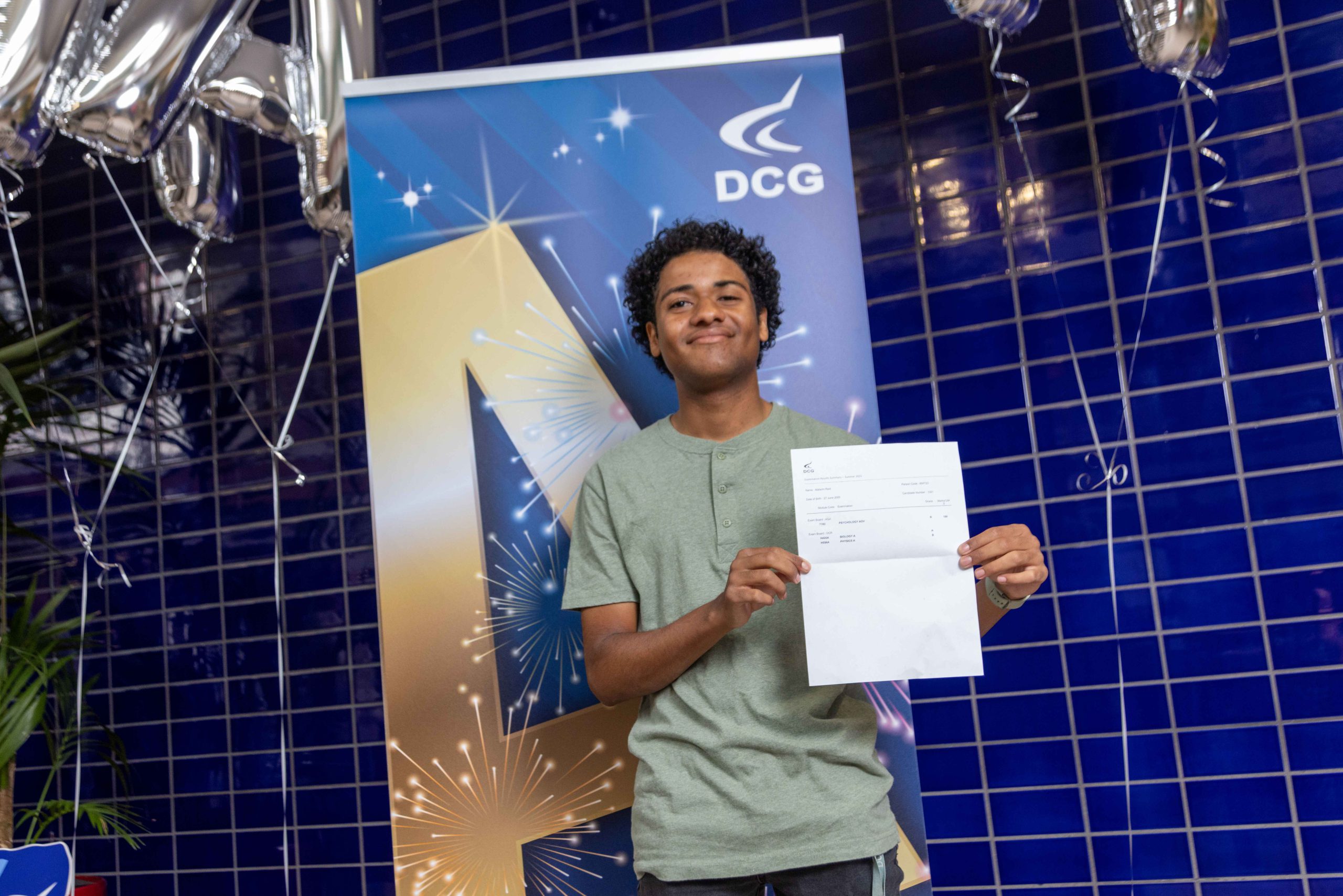 Malachi Reid holding his results.