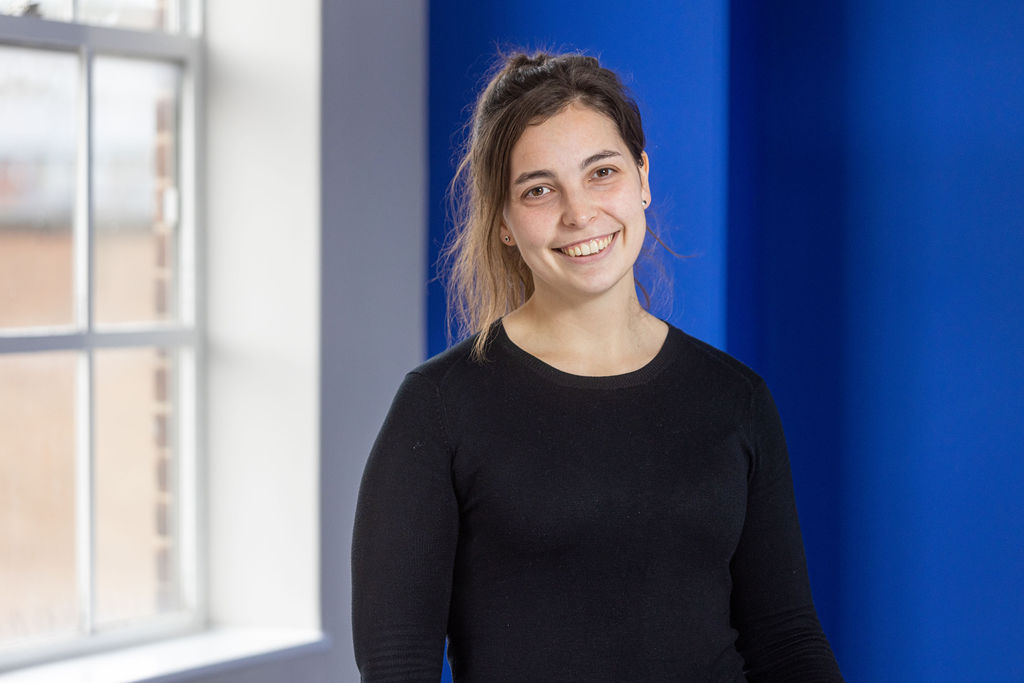 Angelina Stankovic, a female apprentice with brown hari wearing a black shirt.