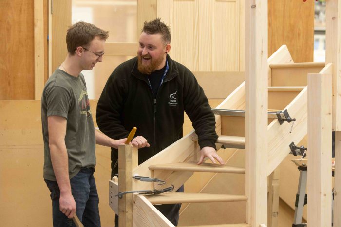 Young apprentice Kai being taught by his teacher.