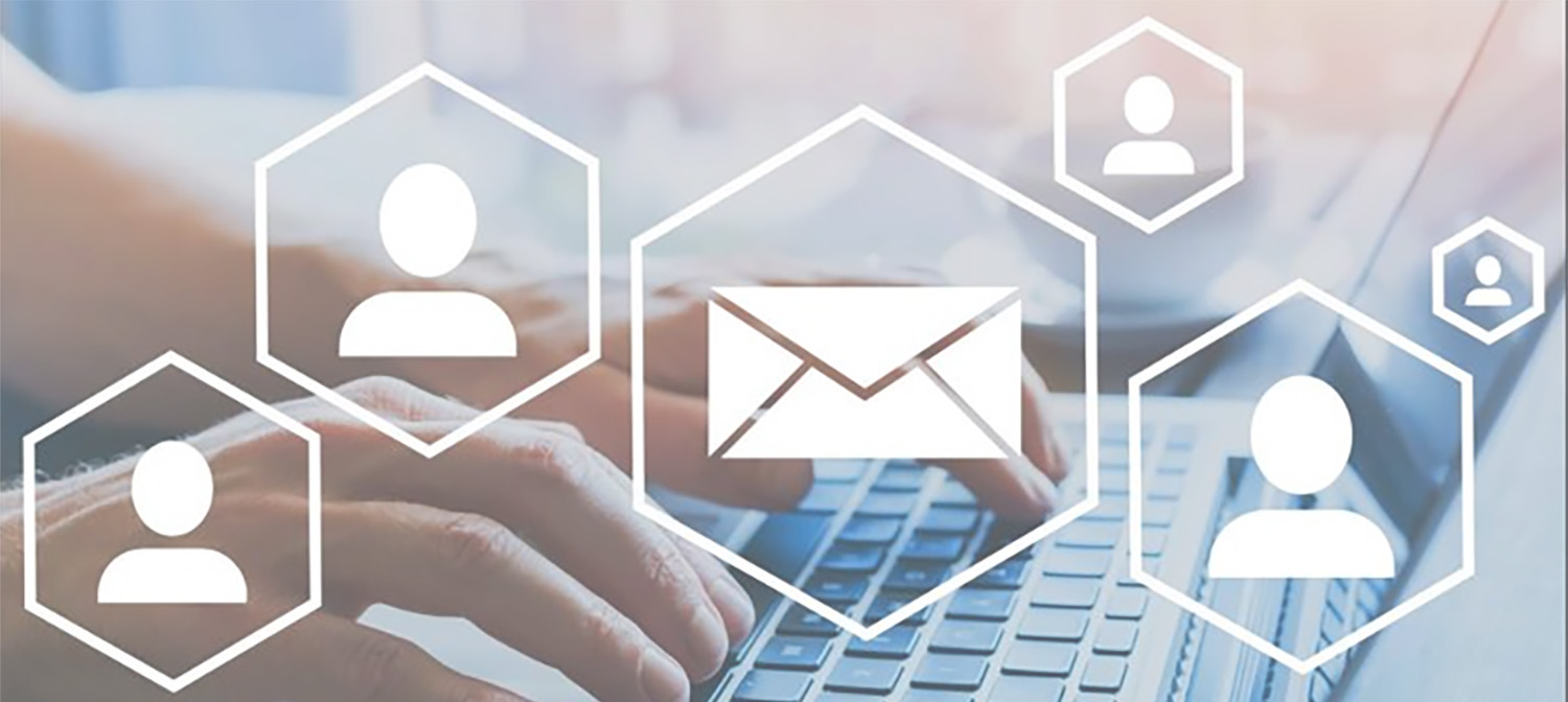 hands typing on keyboard with mail icon