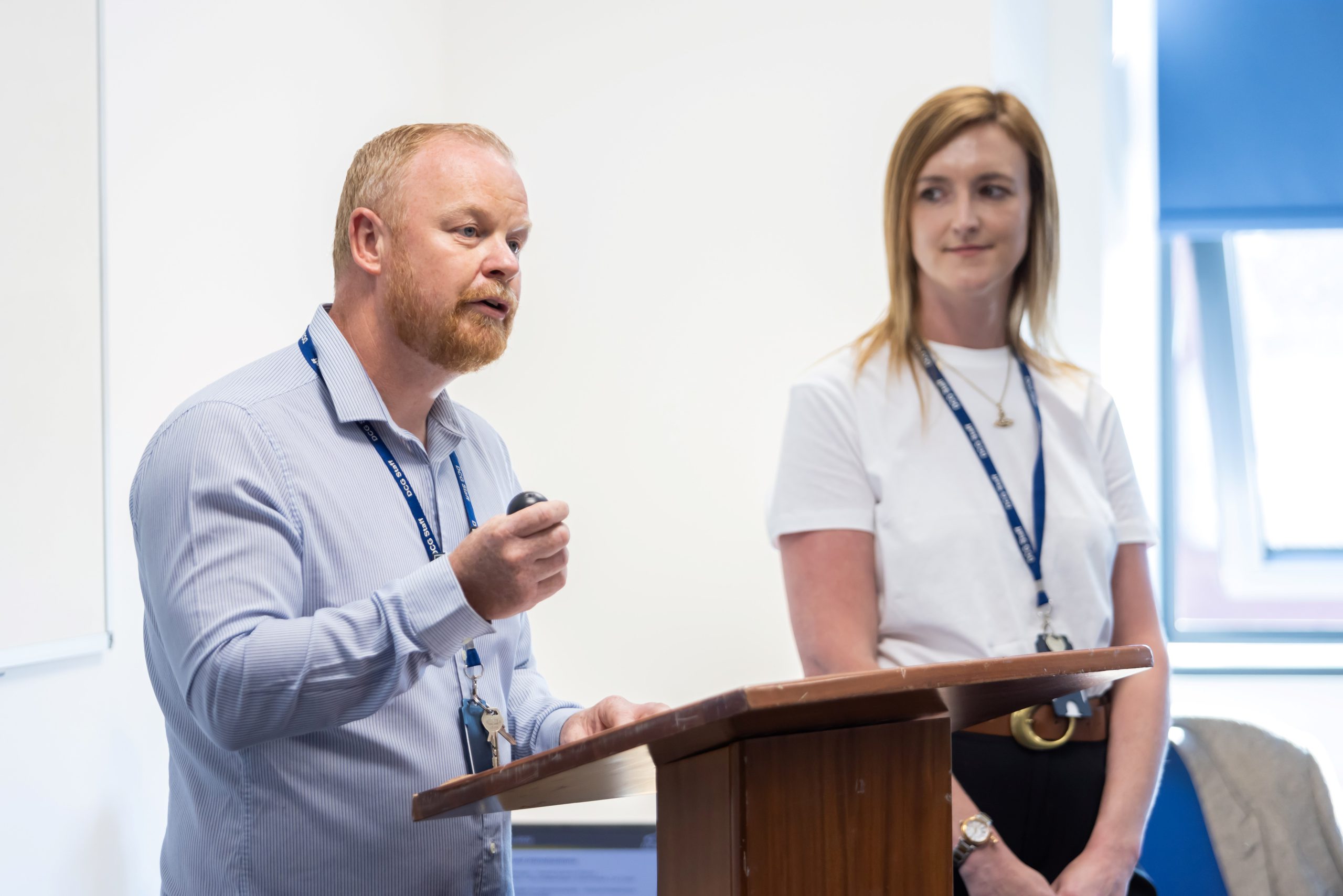 A man addressing an audience at a lectern