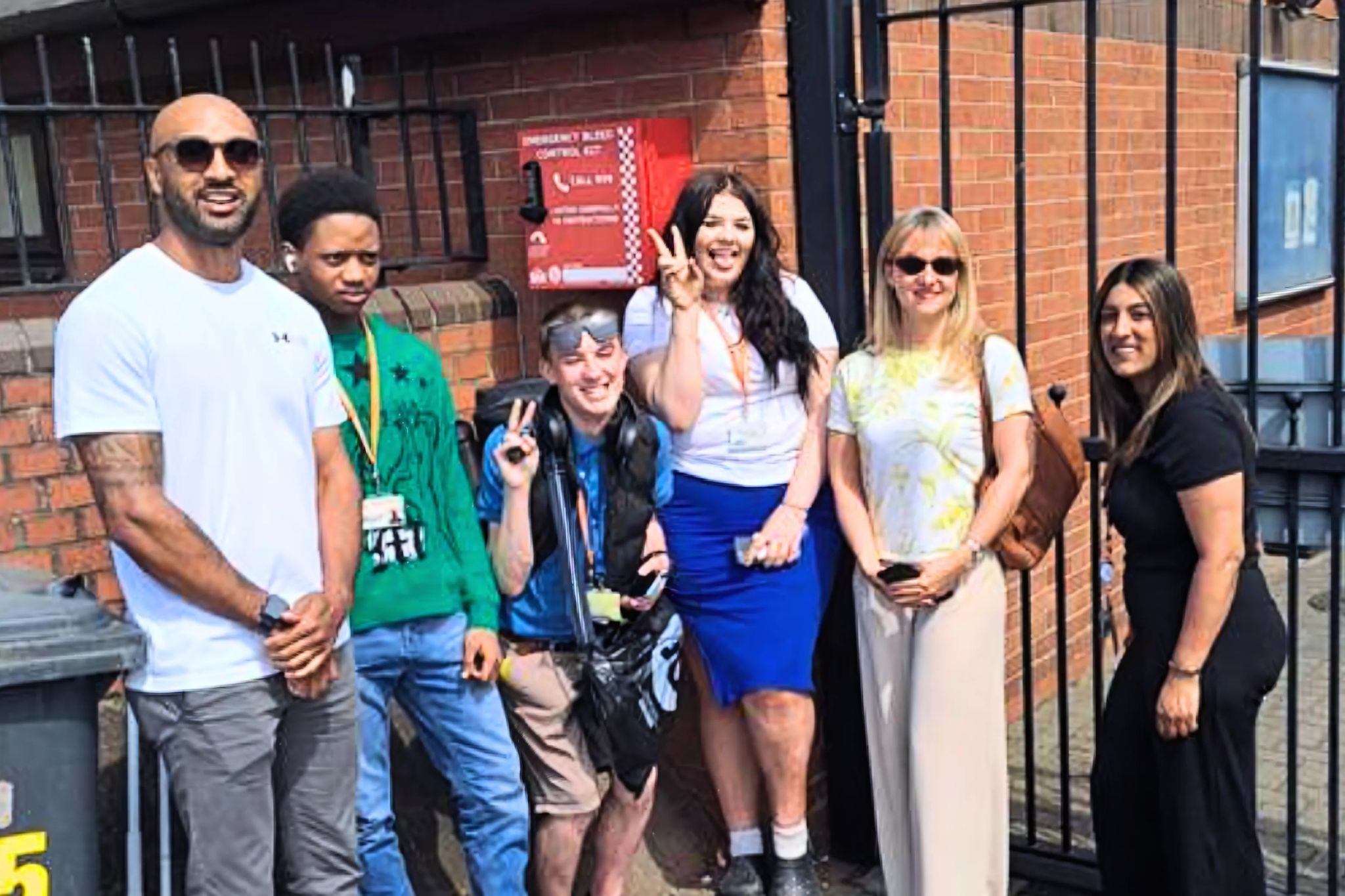 A group of students stood by a defibralator
