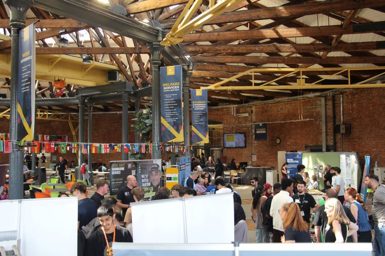 A group of people at an event in a large room