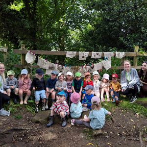 Teachers outside with young children at a nursery