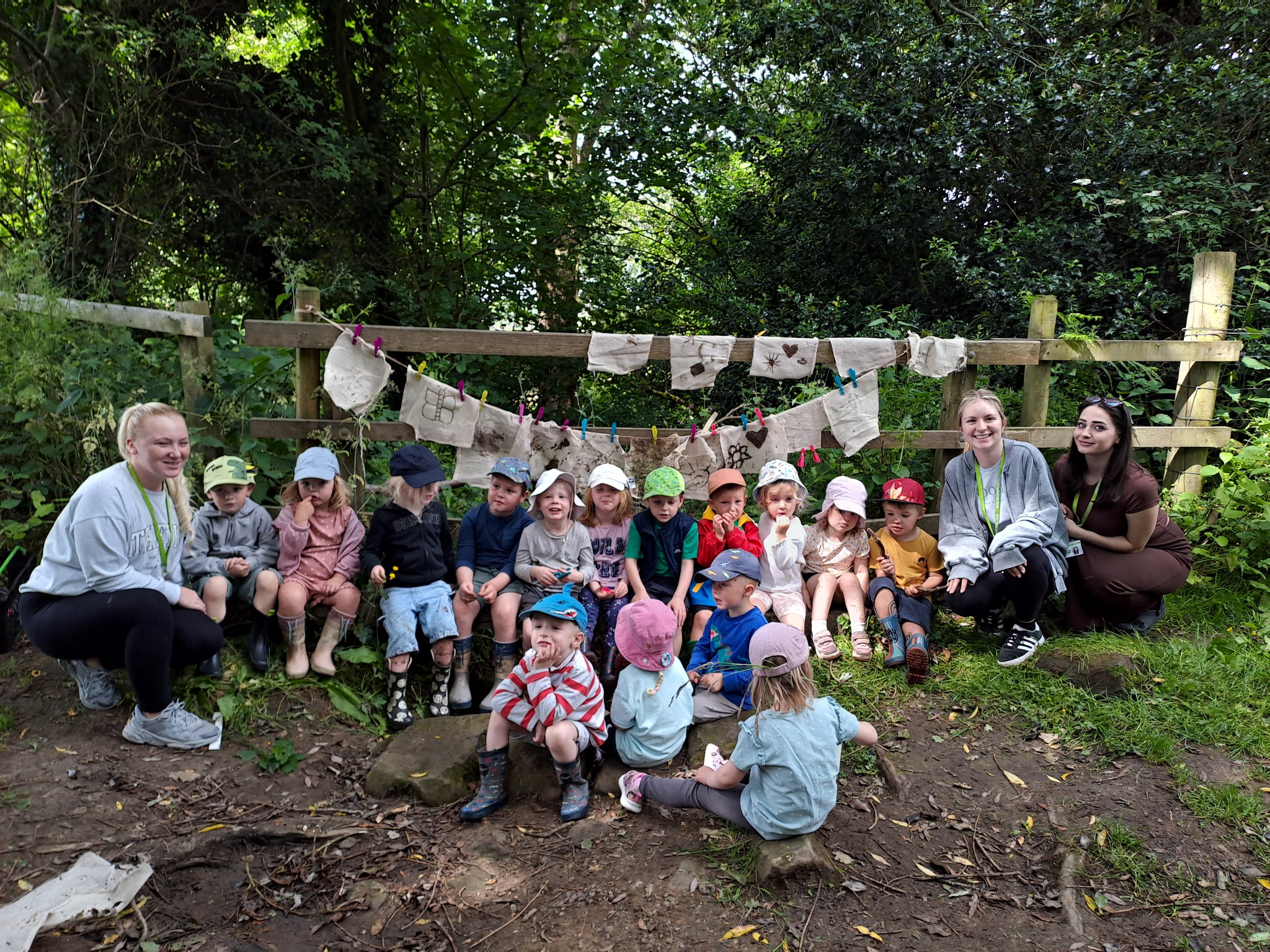 Teachers outside with young children at a nursery