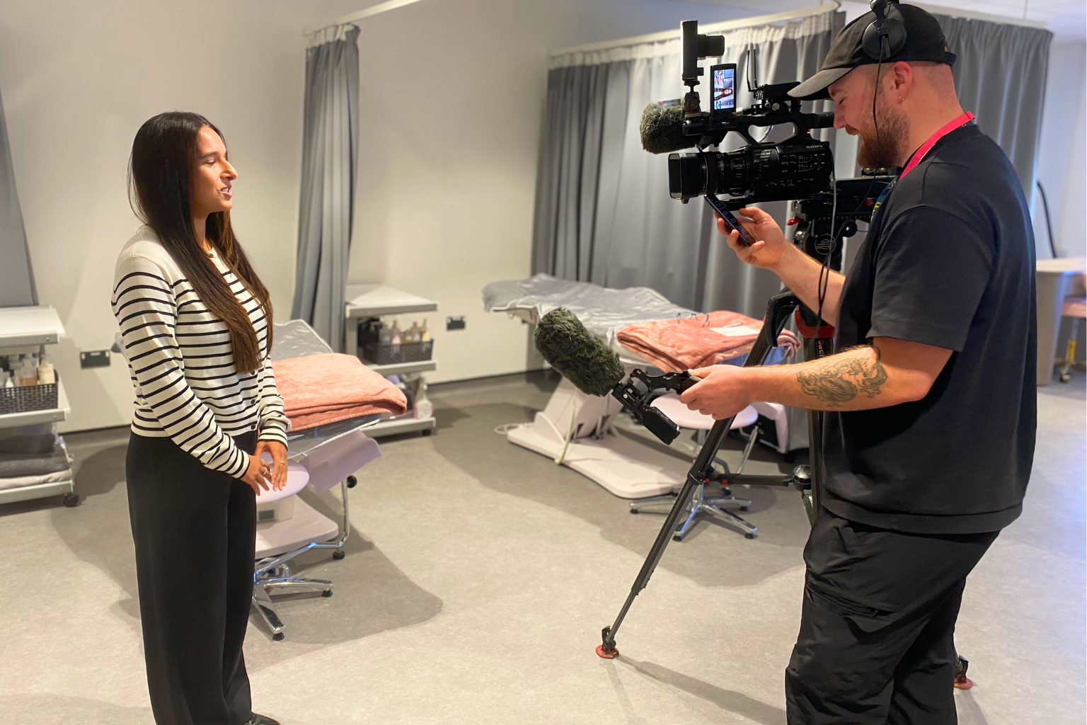 Beauty student talking to a cameraman for the news.