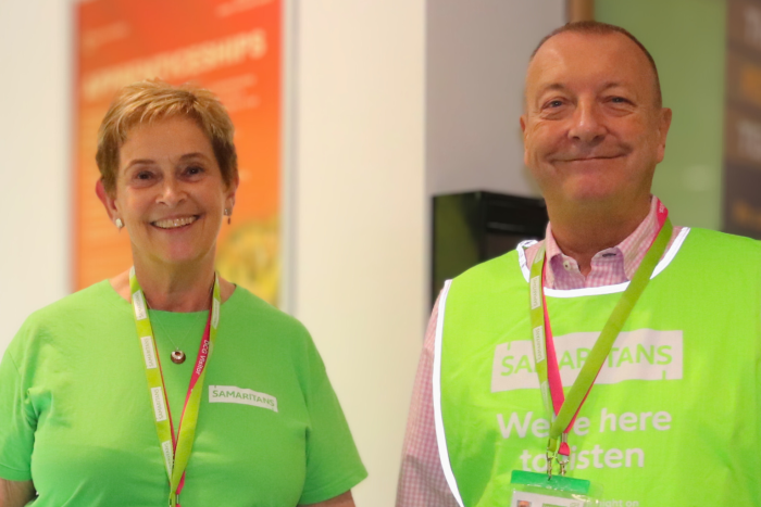 Representatives from the Samaritans wearing green uniforms at Freshers' Fair