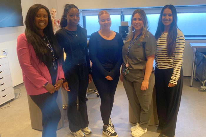 Three Beauty students with their teacher.