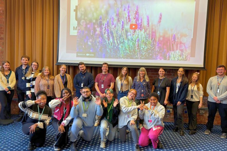 Group of staff and students posing for a photo.
