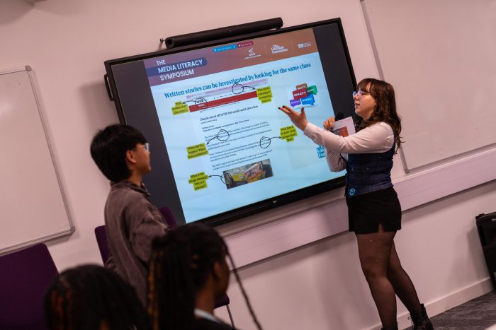 Two Derby College students and Media Literacy Ambassadors delivering a presentation.