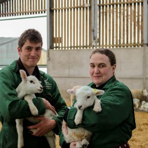 Agriculture students handling lambs at Broomfield Hall, Derbyshire.