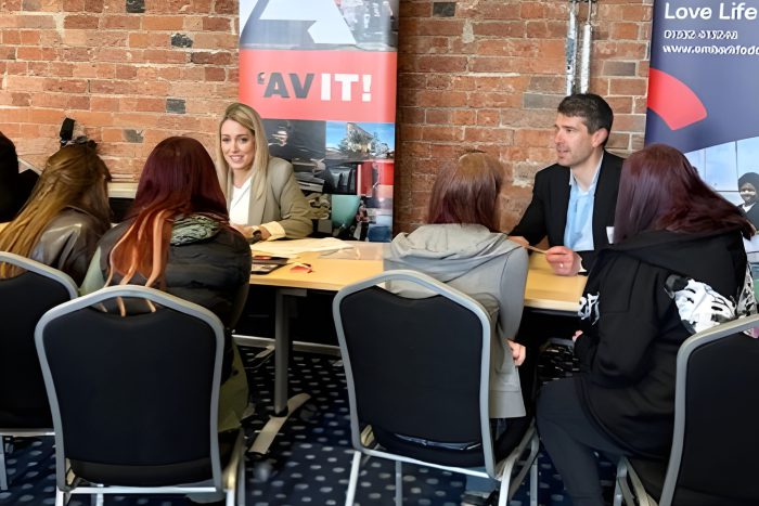 Students taking part in a speed‑networking activity with local business representatives at the Derby College Group networking event, developing communication and employability skills.