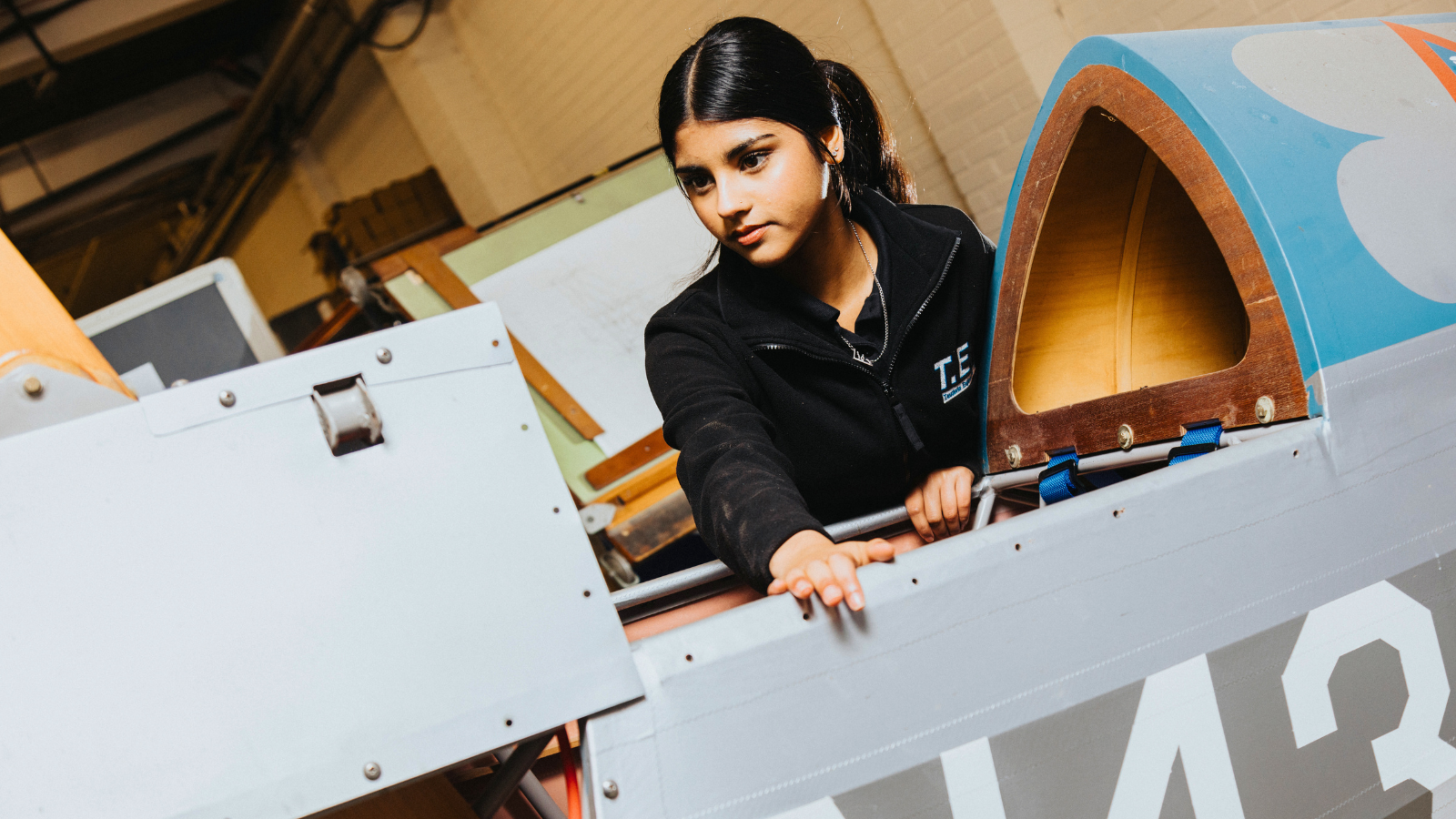 Derby College Engineering T Level student, Hafza, working with engineering tools.