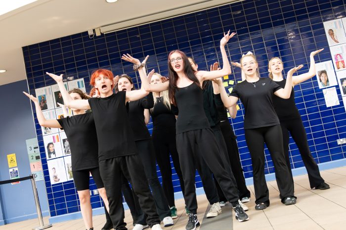 Performing arts students taking part in a live showcase at Derby College Creative & Digital Exhibition
