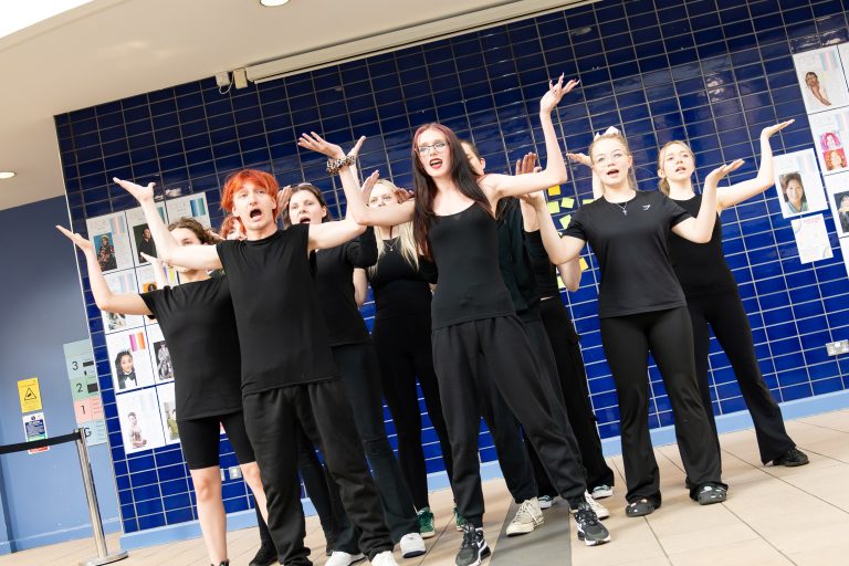 Performing arts students taking part in a live showcase at Derby College Creative & Digital Exhibition