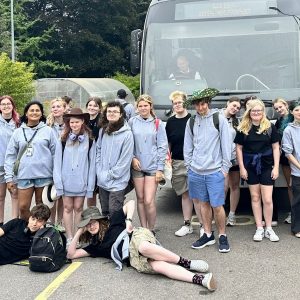 Derby College Group Animal Care students stood in front of a coach taking them to the airport for their turtle conservation project.