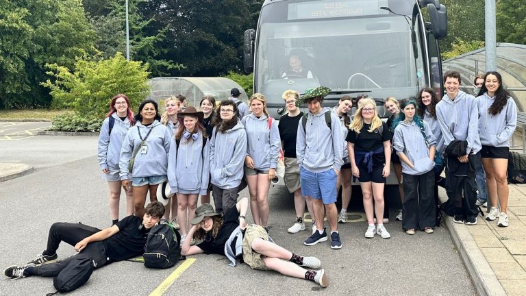 Derby College Group Animal Care students stood in front of a coach taking them to the airport for their turtle conservation project.