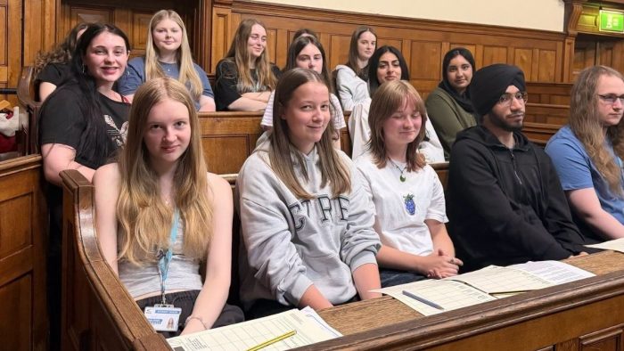 Derby College Group students seated in a courtroom during a Crown Court visit as part of A-level Project Week