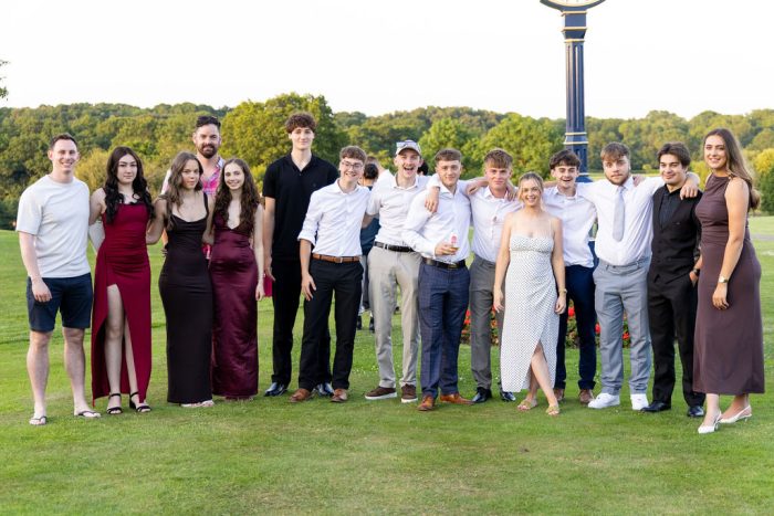 Sports students wearing suits and dresses at graduation ball