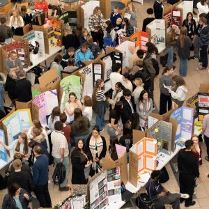 An atrium full of Derby College students at the EPQ Showcase