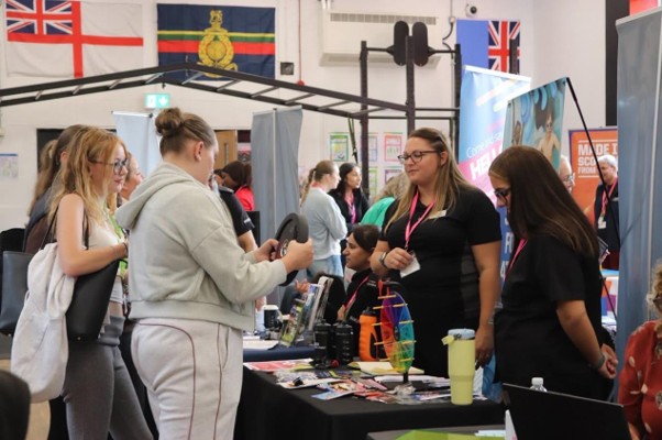 New students talking to employers at Derby College Freshers' Fair