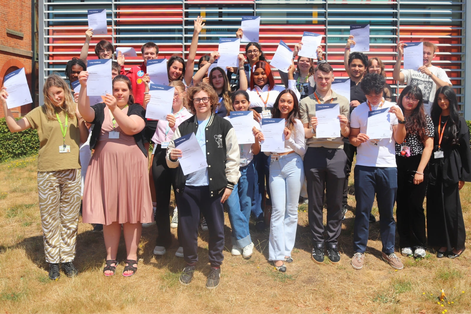 Students celebrating their achievements with their certificates