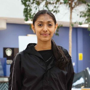 Rajasi Soni, a Derby College student holding her results paper at the Joseph Wright Centre.